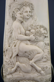 A carved ivory tobacco rasp depicting Satyr with a nymph, Dieppe, early 18th C.