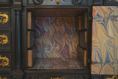 A South-German ebony veneer and gilded copper cabinet, 17th C.