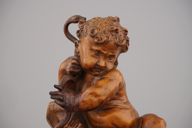 A carved boxwood figure of Hercules with a snake, ca. 1620