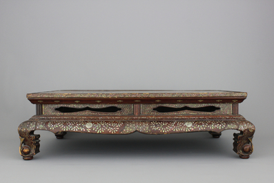A Chinese wood and mother of pear inlaid tea table, 19th C.