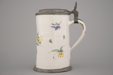 A polychrome French faience pewter mounted mug, 18th C.