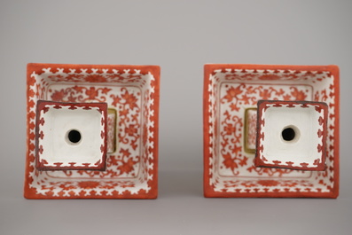 A pair of Chinese porcelain coral red decorated altar candlesticks, 19th C.