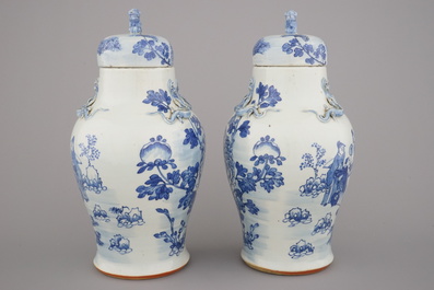 A pair of blue and white Chinese porcelain vases and covers, 19th C.