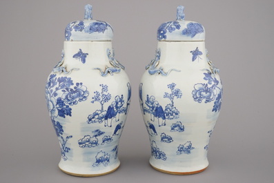 A pair of blue and white Chinese porcelain vases and covers, 19th C.