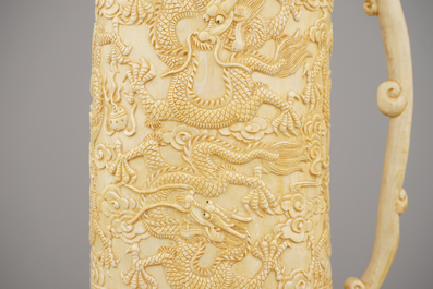 A fine Chinese carved ivory mug with lid, ca. 1900
