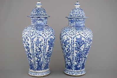 A pair of Chinese porcelain blue and white vases and covers, Kangxi, ca. 1700