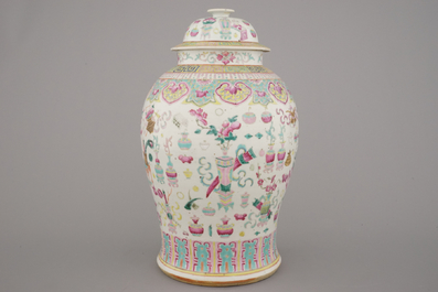 A Chinese porcelain famille rose vase and cover with a decoration of scholar's objects, 19th C.
