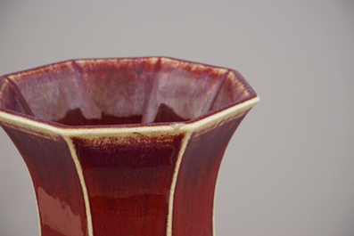 A Chinese porcelain monochrome red vase with peach handles, 18/19th C.