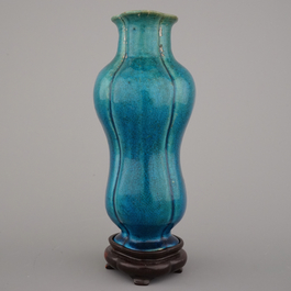 An unusual Chinese turquoise monochrome vase on carved wood stand, 18th C.