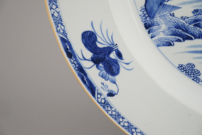 A Chinese porcelain blue and white dish with ladies in a garden, Qianlong, 18th C.