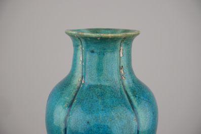 An unusual Chinese turquoise monochrome vase on carved wood stand, 18th C.