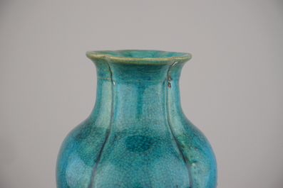 An unusual Chinese turquoise monochrome vase on carved wood stand, 18th C.