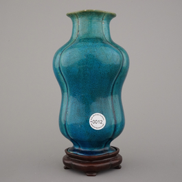 An unusual Chinese turquoise monochrome vase on carved wood stand, 18th C.