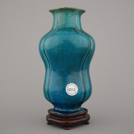 An unusual Chinese turquoise monochrome vase on carved wood stand, 18th C.