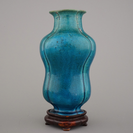 An unusual Chinese turquoise monochrome vase on carved wood stand, 18th C.