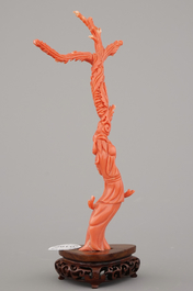 A fine sculpted Chinese red coral branch with a Guanyin, birds and flowers, 19th C.