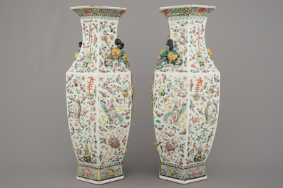 A fine pair of Chinese famille rose relief-decorated hexagonal vases, 19th C.