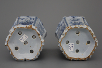 A pair of Dutch Delft blue and white flower holders, 18th C.
