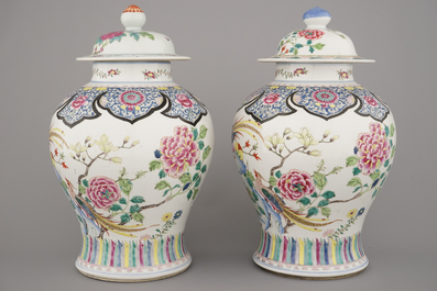 A pair of Chinese porcelain famille rose vases with floral decoration, 19th C.