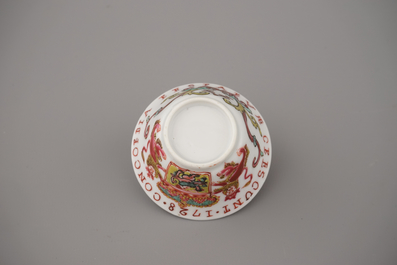 A Chinese porcelain famille rose armorial cup and saucer with VOC coat of arms, dated 1728, Yongzheng