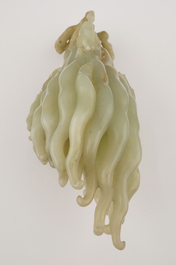 A jade buddha hand on a carved wood stand, Qing dynasty, 18th C.