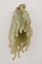 A jade buddha hand on a carved wood stand, Qing dynasty, 18th C.