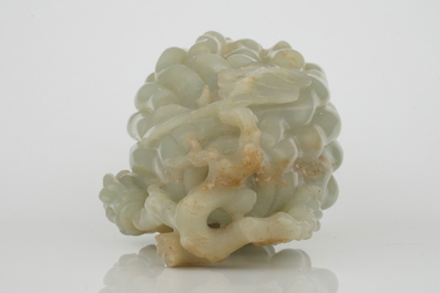 A jade buddha hand on a carved wood stand, Qing dynasty, 18th C.