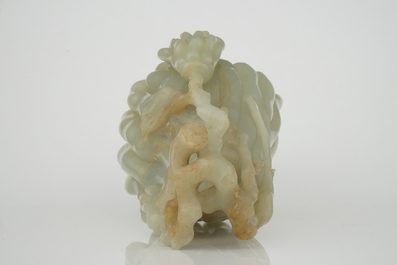 A jade buddha hand on a carved wood stand, Qing dynasty, 18th C.