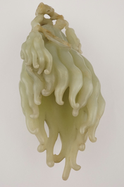 A jade buddha hand on a carved wood stand, Qing dynasty, 18th C.