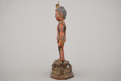 A Chinese gilt and lacquered bronze figure of the infant buddha, Ming dynasty