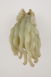 A jade buddha hand on a carved wood stand, Qing dynasty, 18th C.