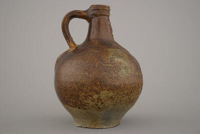 A German stoneware bellarmine jug, 17th C.