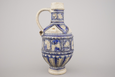 A Westerwald jug, decorated with historical panels, early 17th C.