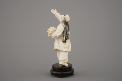 A fine Chinese Cultural Revolution carved ivory figure of a girl