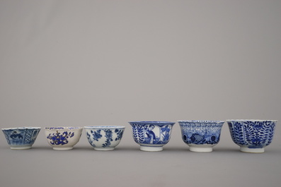 A collection of mostly blue and white Chinese porcelain plates, cups and saucers, 18/19th C.