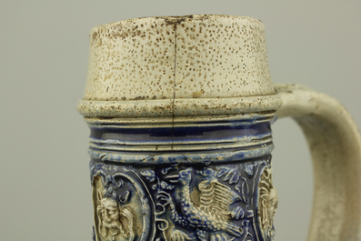 A Westerwald jug, decorated with historical panels, early 17th C.