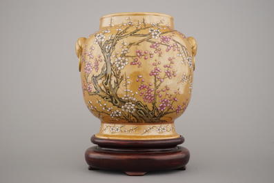 An unusual Chinese famille rose brown ground vase on stand, 19th C.