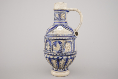 A Westerwald jug, decorated with historical panels, early 17th C.