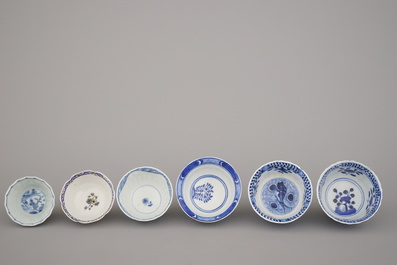 A collection of mostly blue and white Chinese porcelain plates, cups and saucers, 18/19th C.