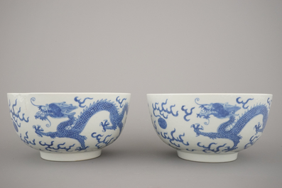 A pair of Chinese porcelain blue and white dragon bowls, 19th C.