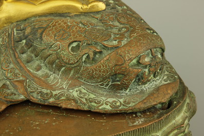 A gilt bronze coral and turquoise inlaid figure of buddha Amoghasiddi, 18/19th C.