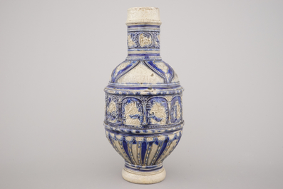 A Westerwald jug, decorated with historical panels, early 17th C.