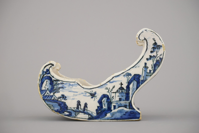 A rare Dutch Delft blue and white pipe holder, modelled as a sleigh, 18th C.