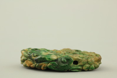 A green mottled jade carving of fruits, 20th C.