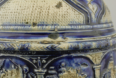 A Westerwald jug, decorated with historical panels, early 17th C.