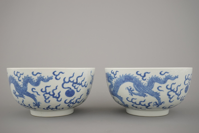 A pair of Chinese porcelain blue and white dragon bowls, 19th C.