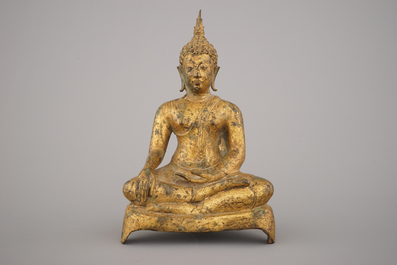A Thai gilt bronze figure of a seated Buddha, 19th C.