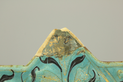 A turquoise ground Lajvardina cold painted star-shaped tile, 14th C.