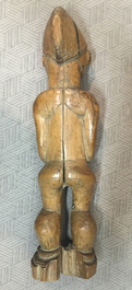 A collection of African Pende figures, bracelets, weapons and a photo album, 19/20th C.