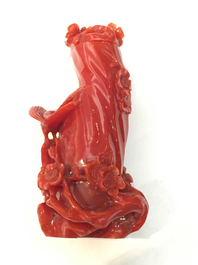 A Chinese carved dark red coral snuff bottle